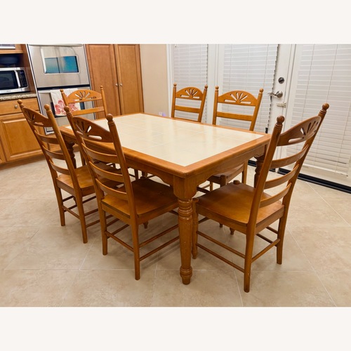 Used Light Brown Wood Dining Table for sale on AptDeco