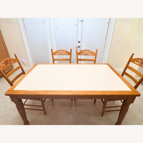 Used Light Brown Wood Dining Table for sale on AptDeco