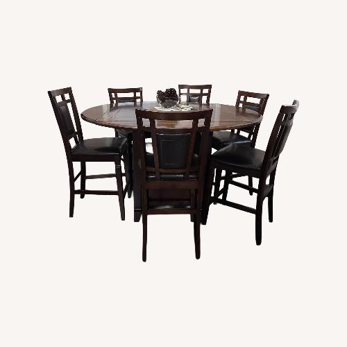 Used Vintage/Antique Dark Brown Wood Dining Set for sale on AptDeco