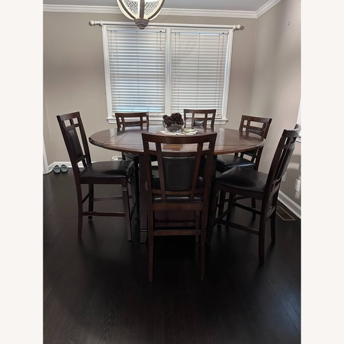 Used Vintage/Antique Dark Brown Wood Dining Set for sale on AptDeco