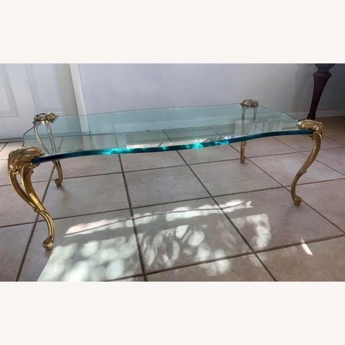 Used Floating GlassTable with Brass Legs for sale on AptDeco