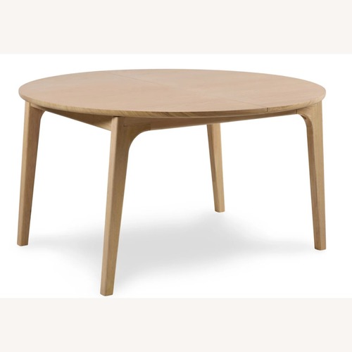 Used Article Plumas Natural Dining Table for sale on AptDeco