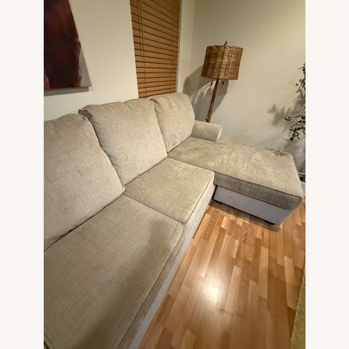 Used Living Spaces Light Brown 2 Piece Sectional for sale on AptDeco