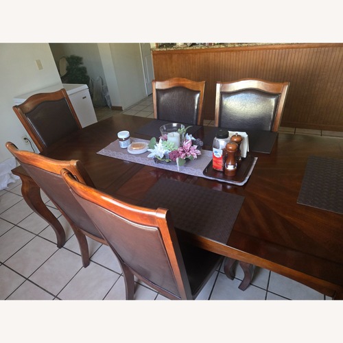 Used 6 Dark Brown Wood Dining Chairs for sale on AptDeco