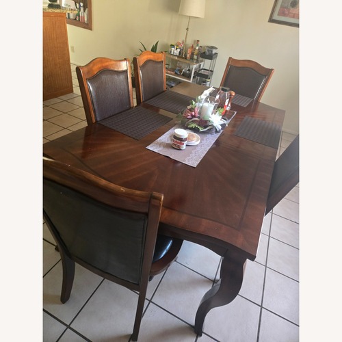 Used 6 Dark Brown Wood Dining Chairs for sale on AptDeco