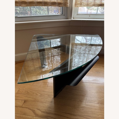 Used Triangular Glass Side Table on Black Metal Frame for sale on AptDeco