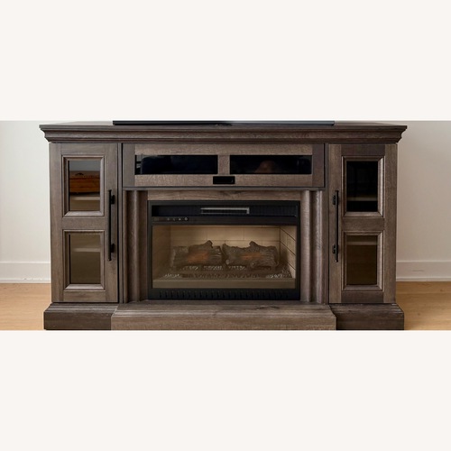Used Grey Fireplace/Heater Storage TV Stand for sale on AptDeco