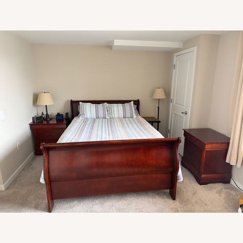 Used Dark Brown Wood Queen Bed for sale on AptDeco