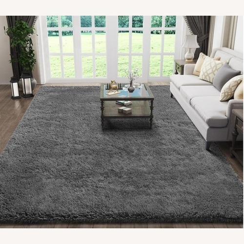 Used Dark Gray Fabric Area Rug 5' x 7' for sale on AptDeco