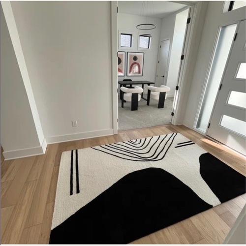 Used Handmade Wool Ivory/Black Rug for sale on AptDeco