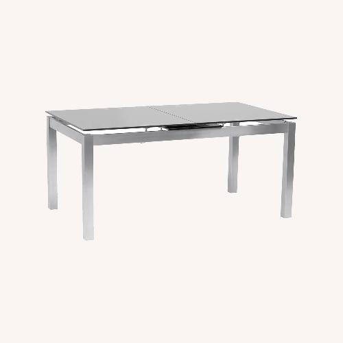 Used Raymour & Flanigan Silver Glass Dining Table for sale on AptDeco