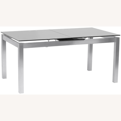 Used Raymour & Flanigan Silver Glass Dining Table for sale on AptDeco
