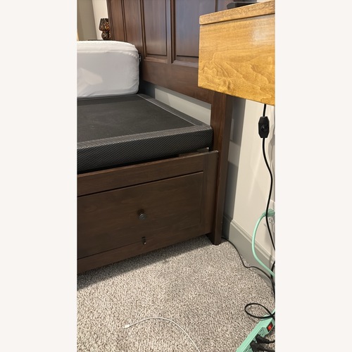 Used Dark Brown Wood King Bed Frame With Storage for sale on AptDeco