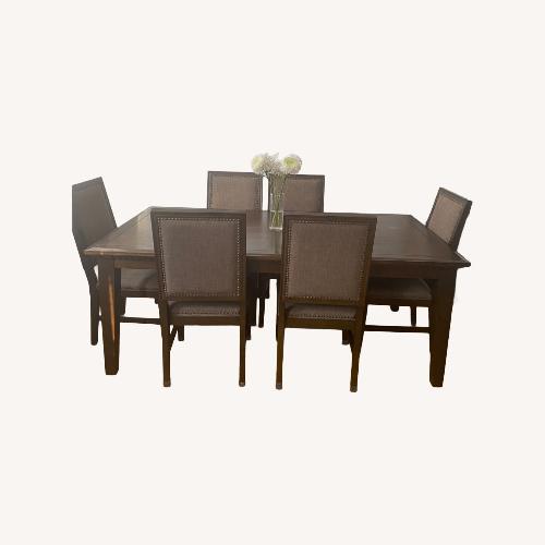 Used Raymour & Flanigan Dark Brown Wood Dining Set for sale on AptDeco