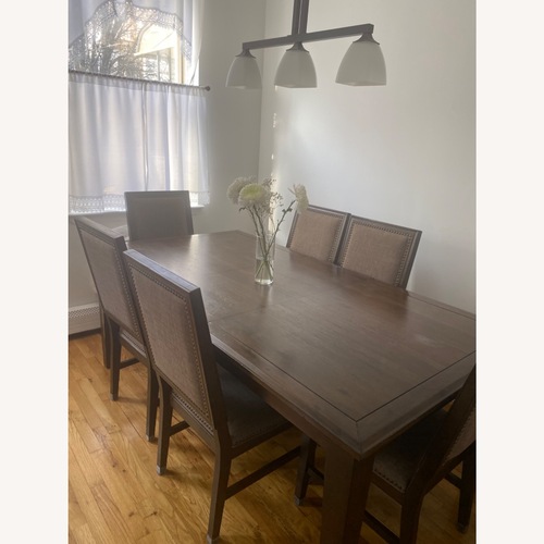 Used Raymour & Flanigan Dark Brown Wood Dining Set for sale on AptDeco