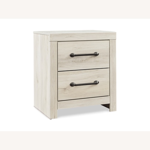 Used Ashley Furniture Cambrick White Wood Nightstand for sale on AptDeco