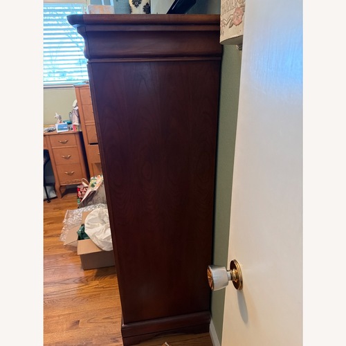 Used Vintage/Antique Light Brown Wood Armoire for sale on AptDeco