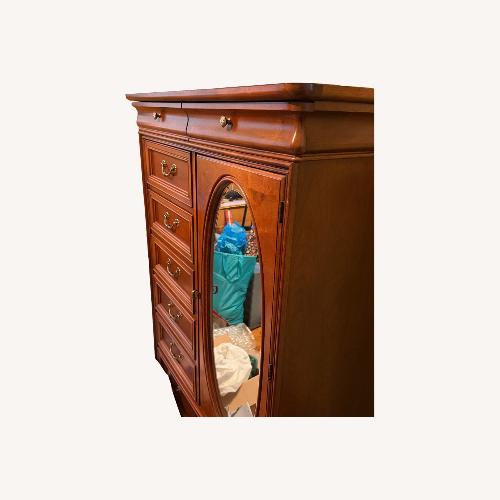 Used Vintage/Antique Light Brown Wood Armoire for sale on AptDeco