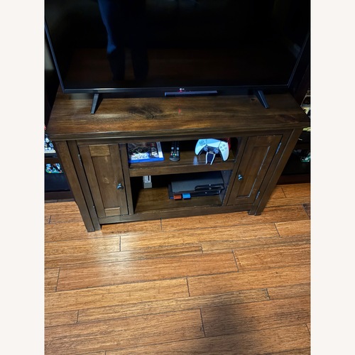 Used Ashley Entertainment Stand for 42" TV for sale on AptDeco