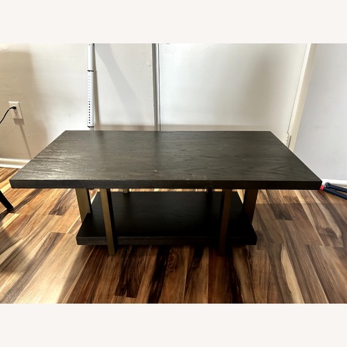 Used Dark Brown Wood Coffee Table for sale on AptDeco