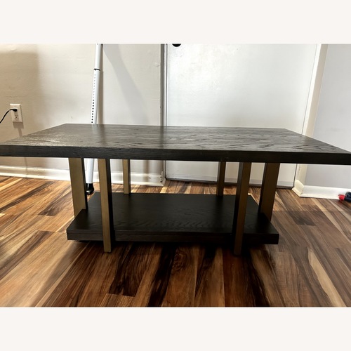 Used Dark Brown Wood Coffee Table for sale on AptDeco