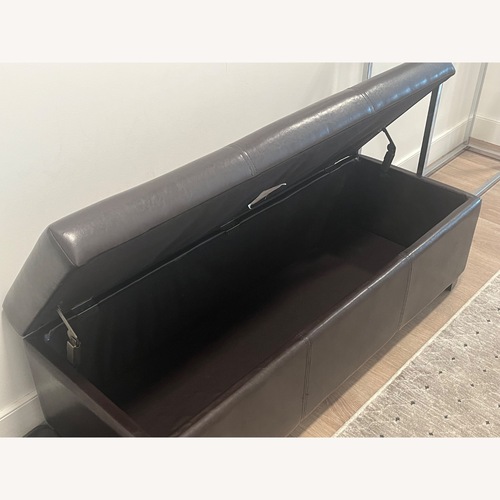 Used Dark Brown Faux Leather Ottoman for sale on AptDeco