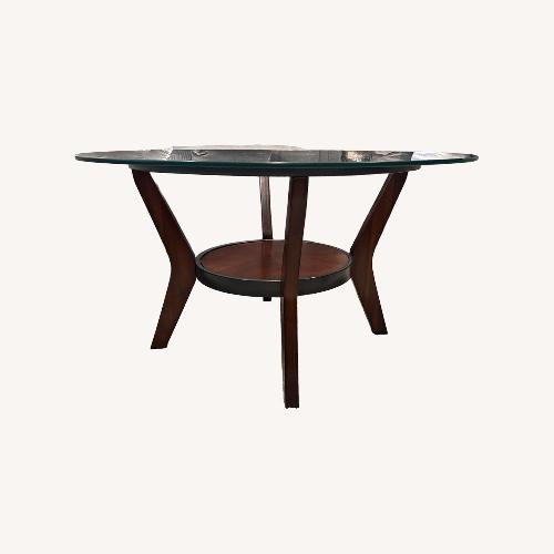 Used Raymour & Flanigan Dark Brown W Glass Top Coffee Table for sale on AptDeco