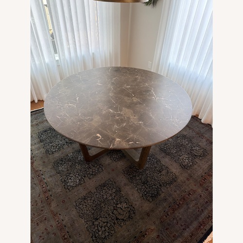 Used Arhaus St Germain 60 in Brown Wood Dining Table for sale on AptDeco