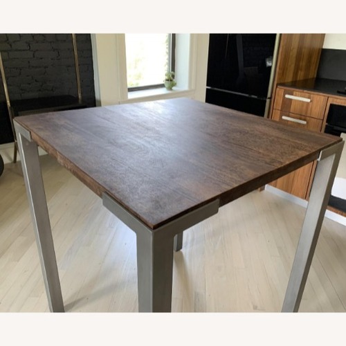 Used CB2 Dark Brown Wood Dining Table for sale on AptDeco