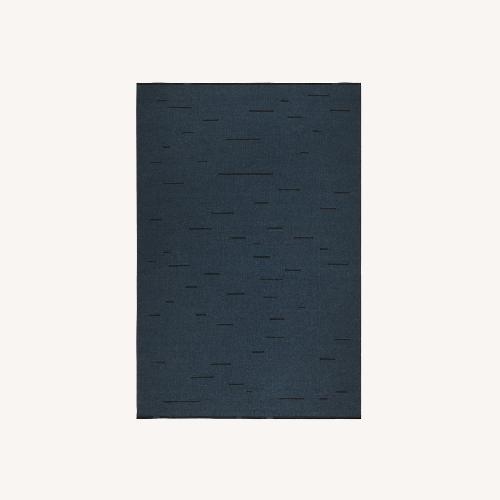 Used Nordic Knots Blue Wool Area Rug 5' x 8' for sale on AptDeco