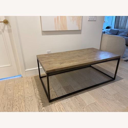Used Canvas Home Natural Wood Coffee Table for sale on AptDeco