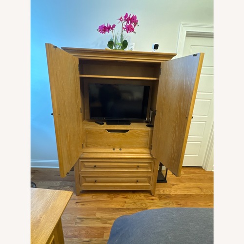 Used Thomasville Furniture Natural Wood Armoire for sale on AptDeco