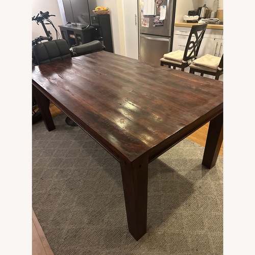 Used James Martin Dark Brown Wood Dining Table for sale on AptDeco