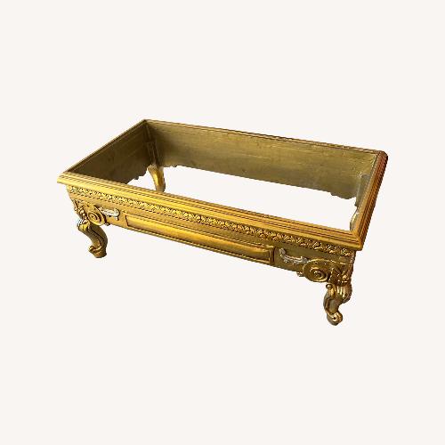 Used Gold Leaf Coffee Table with Tavertine Top for sale on AptDeco
