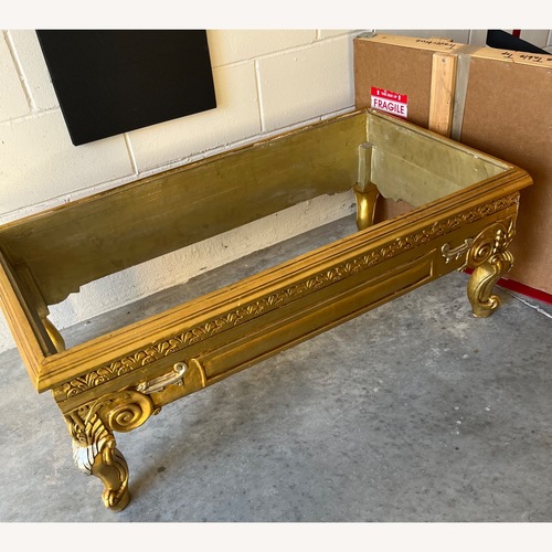 Used Gold Leaf Coffee Table with Tavertine Top for sale on AptDeco