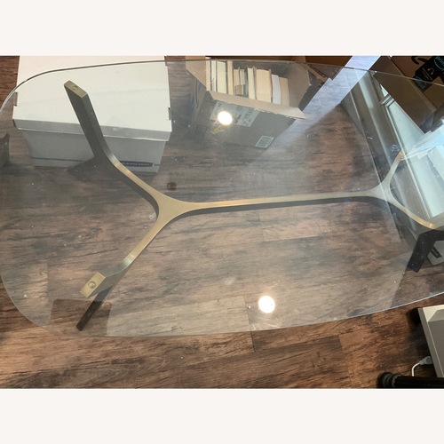 Used Glass Coffee Table with Metal Base for sale on AptDeco