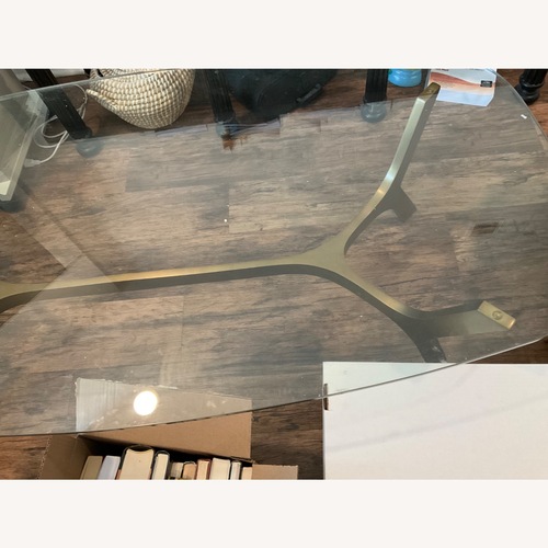 Used Glass Coffee Table with Metal Base for sale on AptDeco