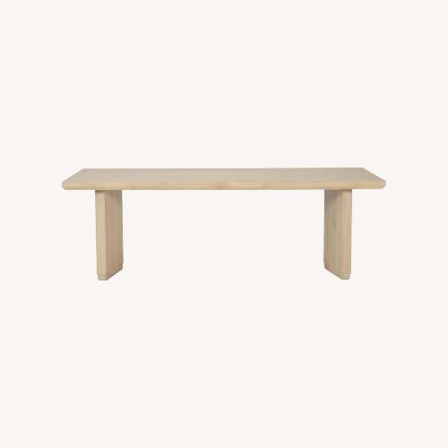 Used Living Spaces Natural Wood Dining Table for sale on AptDeco