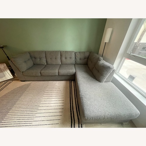 Used Living Spaces Grey Sectional Sofa for sale on AptDeco