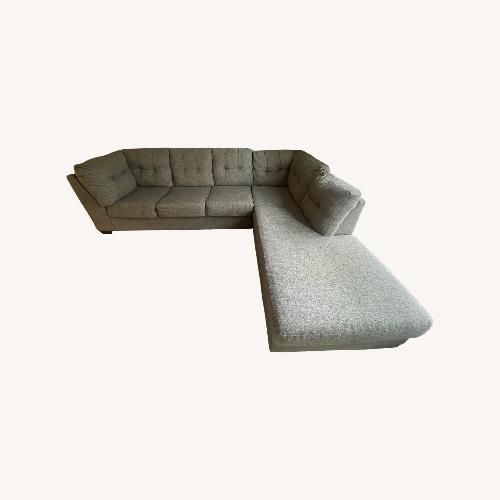 Used Living Spaces Grey Sectional Sofa for sale on AptDeco