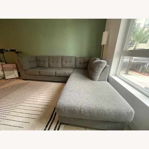 Used Living Spaces Grey Sectional Sofa for sale on AptDeco