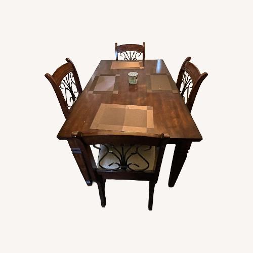 Used Dark Brown Dining Table for sale on AptDeco