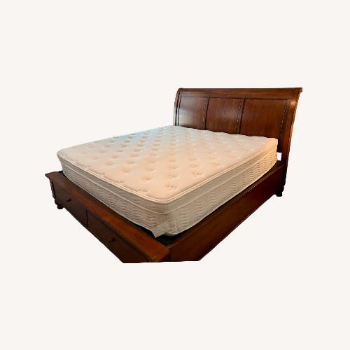 Used Furniture Row Dark Brown Wood King Bed for sale on AptDeco