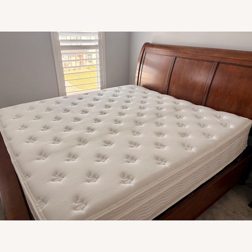 Used Furniture Row Dark Brown Wood King Bed for sale on AptDeco