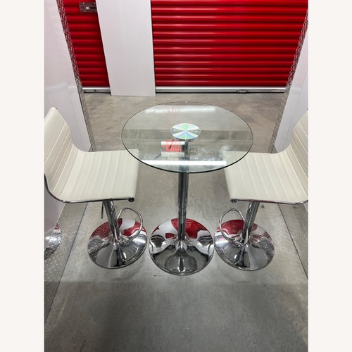 Used Glass Cocktail Table and Chairs for sale on AptDeco