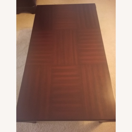 Used Rooms To Go  Wood Cassara Coffee Table Set for sale on AptDeco