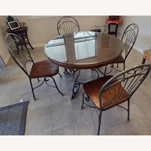 Used Dark Brown Wood Dining Set for sale on AptDeco