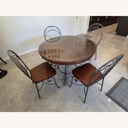 Used Dark Brown Wood Dining Set for sale on AptDeco