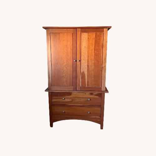 Used Dark Brown Wood Armoire for sale on AptDeco