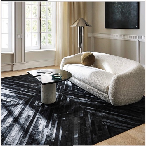 Used CB2 Naho Patchwork Black Hide Area Rug 9x12 for sale on AptDeco